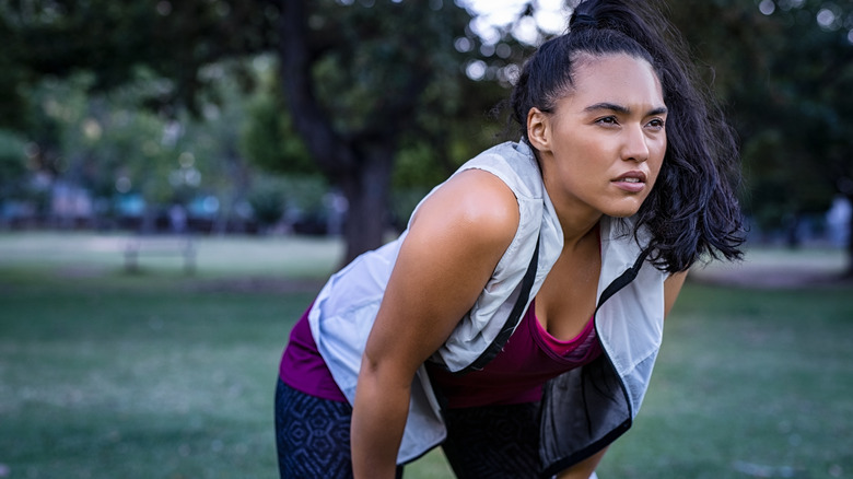 woman taking break from exercise