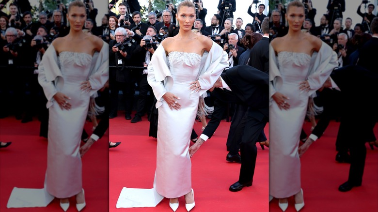 Bella Hadid wearing a boring silver dress by Prada at the 2026 Cannes Film Festival