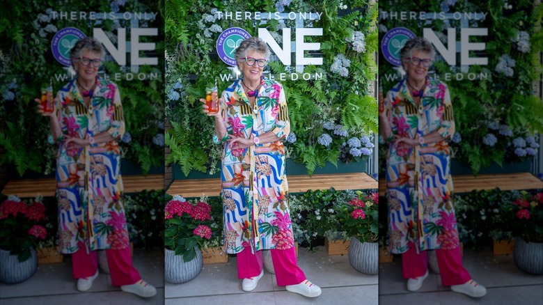 Prue Leith at Wimbledon 2026 wearing a long printed tunic.