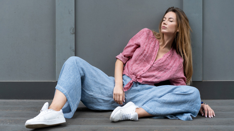 woman in white linen pants