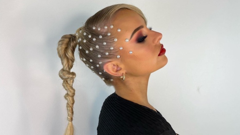 Woman with pearl gems on hair
