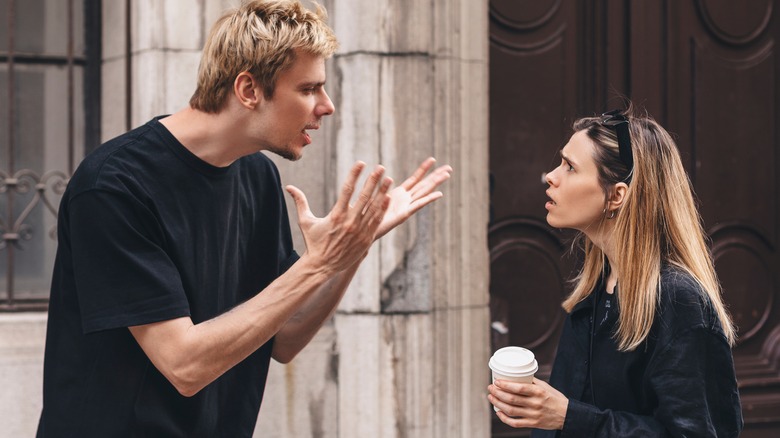 Couple arguing outside