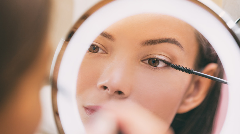 Women applying mascara