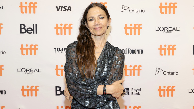 Justine Bateman posing in a grey dress