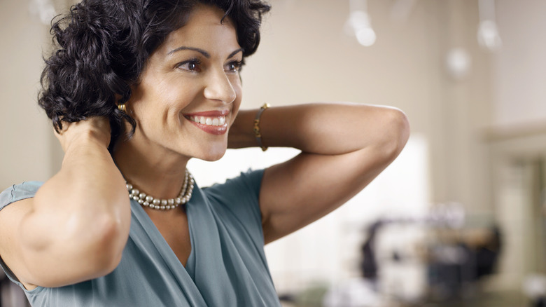 Woman trying on a necklace