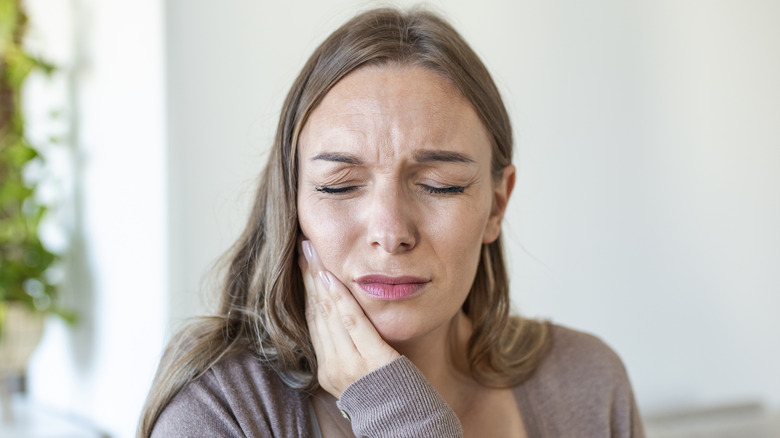 Woman with aching jaw
