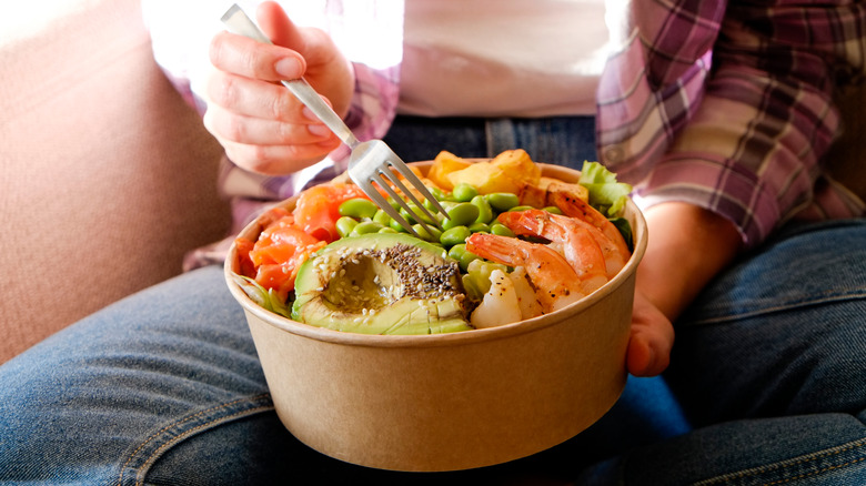 Healthy food in takeout bowl