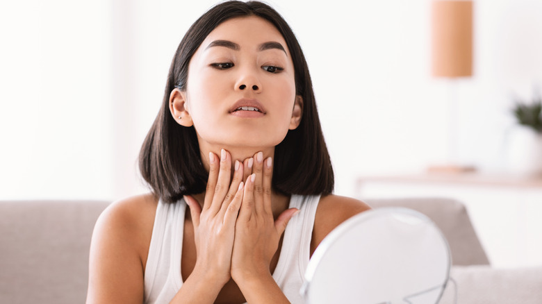 woman looking at neck