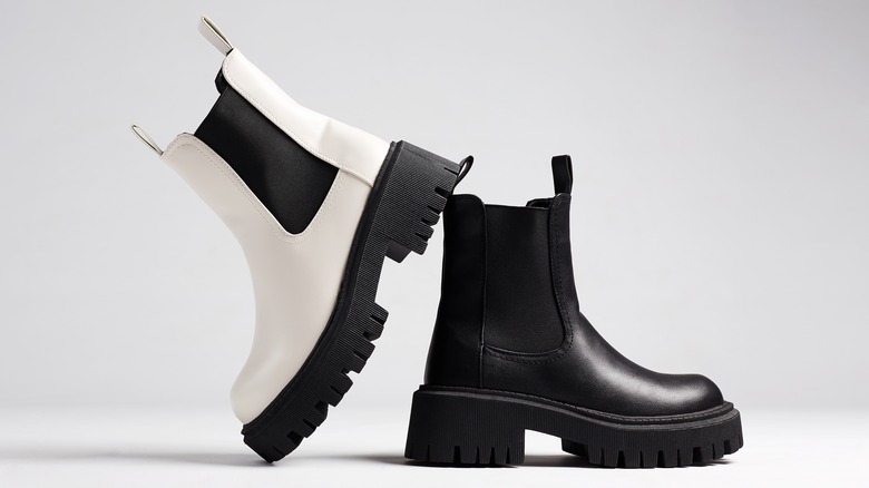 Two different color chelsea boots