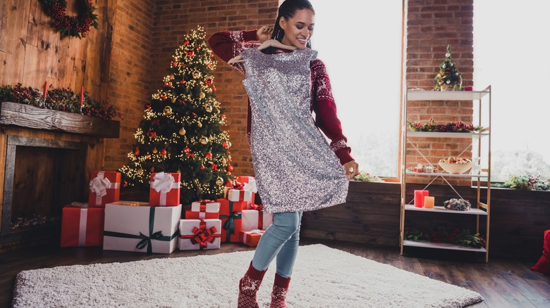 Woman on Christmas holding dress