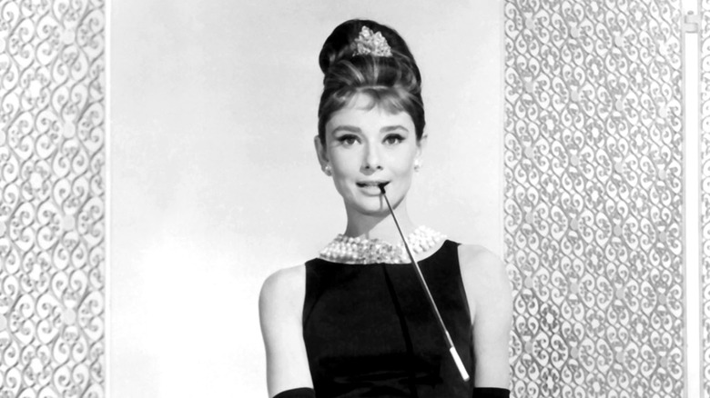 Audrey Hepburn posing in an LBD