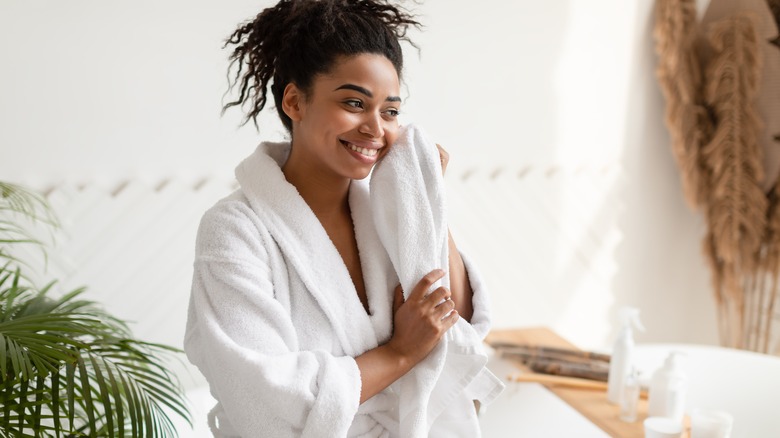 person drying off after shower