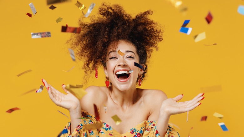 woman celebrating birthday with confetti