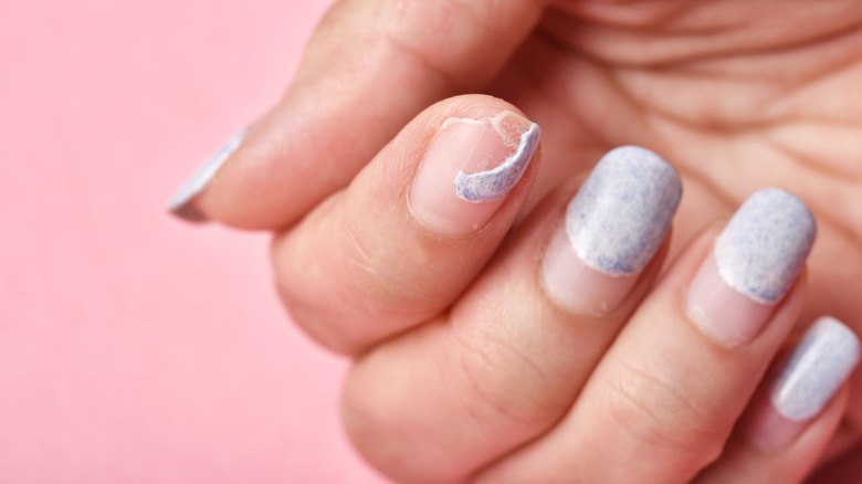 broken nail with manicure