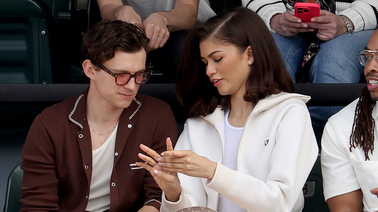 Zendaya and Tom Holland dressed casually for an event