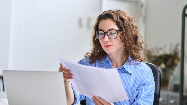 woman looking at papers