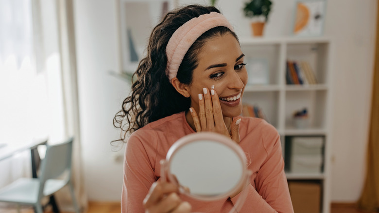 woman applying face cream