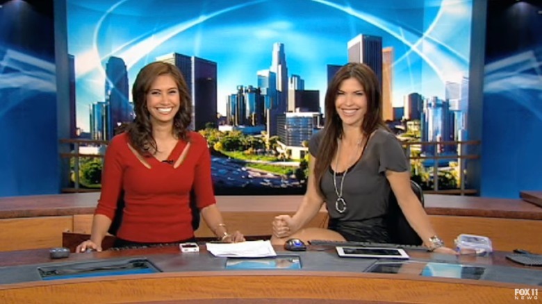 Maria Quiban and Lauren Sanchez smile while seated at the desk on Fox 11 Los Angeles news program