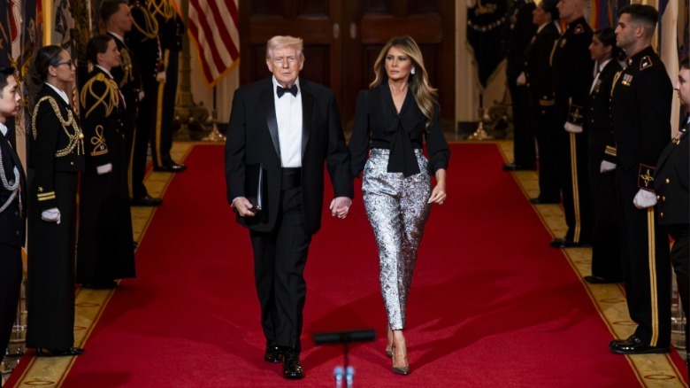 President Donald Trump and first lady Melania Trump arrive during the National Governors Association Evening Dinner and Reception in the East Room of the White House on February 21