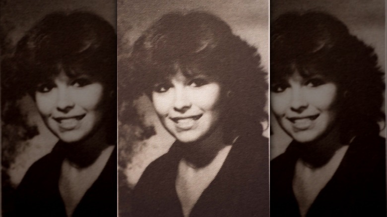 Pamela Anderson posing for a high school yearbook photo.