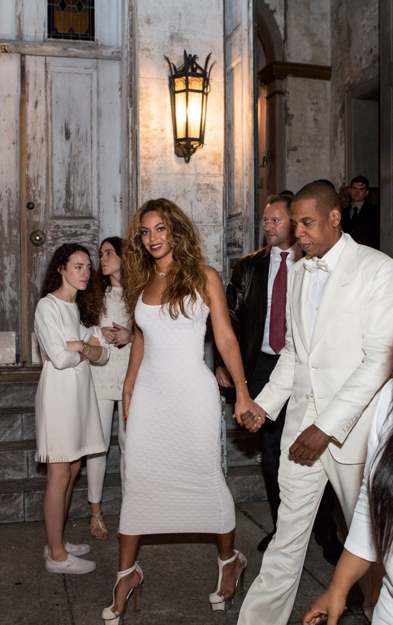 Beyoncé wearing a white outfit at Solange's wedding in 2014