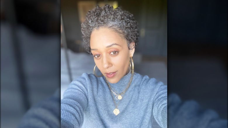 Tia Mowry taking a selfie with gray hair