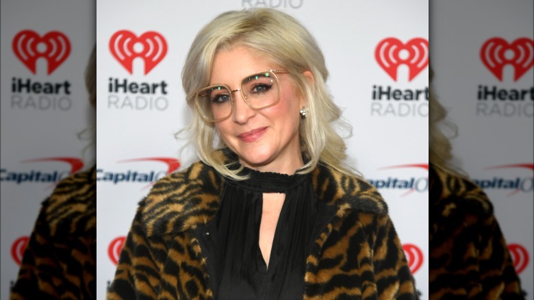 Staci Keanan at an iHeart radio even t in 2024 with bright blond hair and glasses