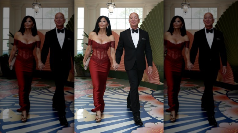 Lauren Sanchez Bezos and Jeff Bezos walking hand-in-hand