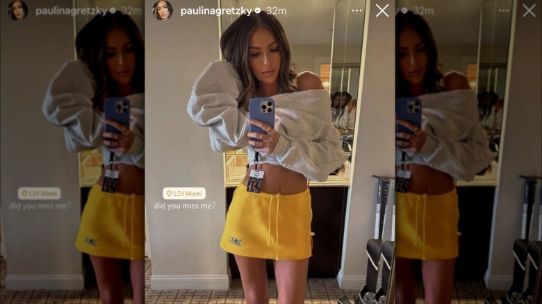 Paulina Gretzky wearing a short yellow skirt