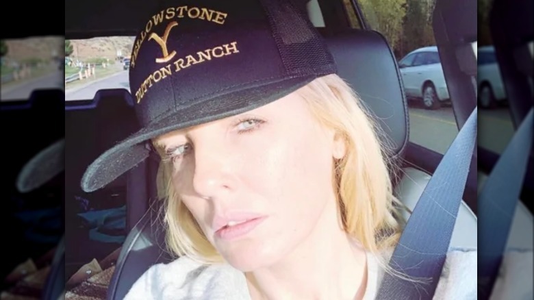 Kelly Reilly takes a car selfie with no makeup on. She is wearing a