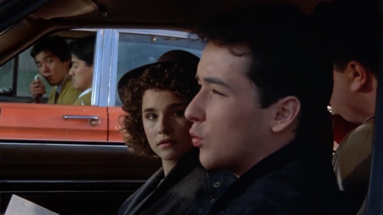 Diane Franklin sitting next to John Cusack in