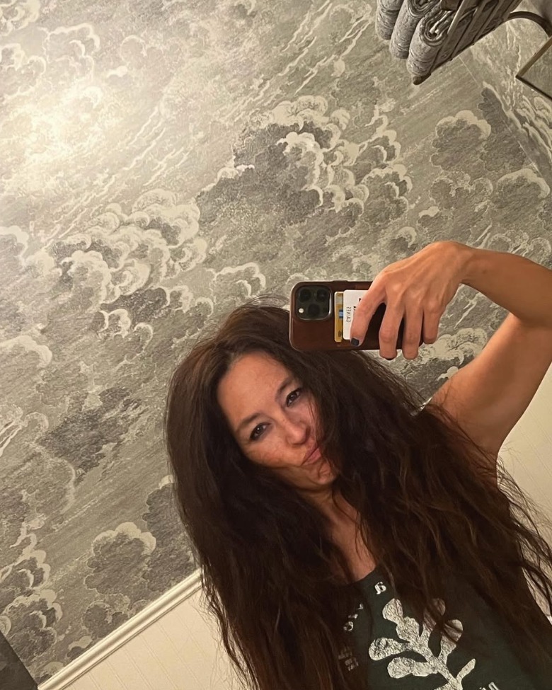 Joanna Gaines posing with frizzy hair after a concert